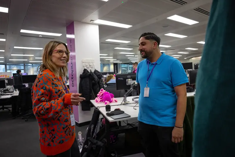 Colleagues chatting in the office